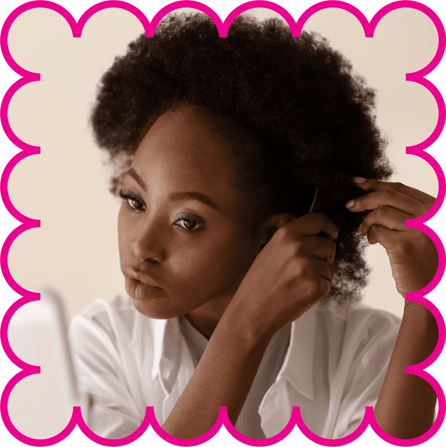 Model styling her natural coily hair